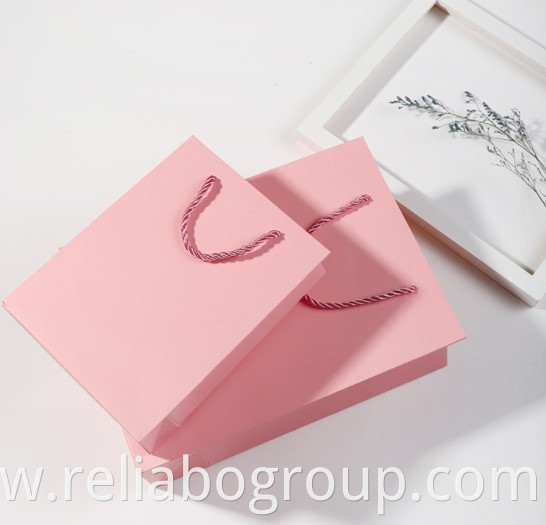 Luxury ribbon handle boutique shopping packaging customized printed euro tote paper gift bags with logo